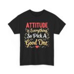 Front view of black unisex heavy cotton t-shirt with "Attitude is Everything" design
