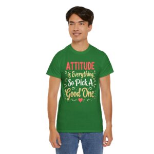 Turf green unisex heavy cotton t-shirt with "Attitude is Everything" design shown on a man (front)