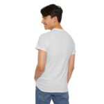 Ash unisex heavy cotton t-shirt with "Be The Game Changer" design shown on a man (back view)