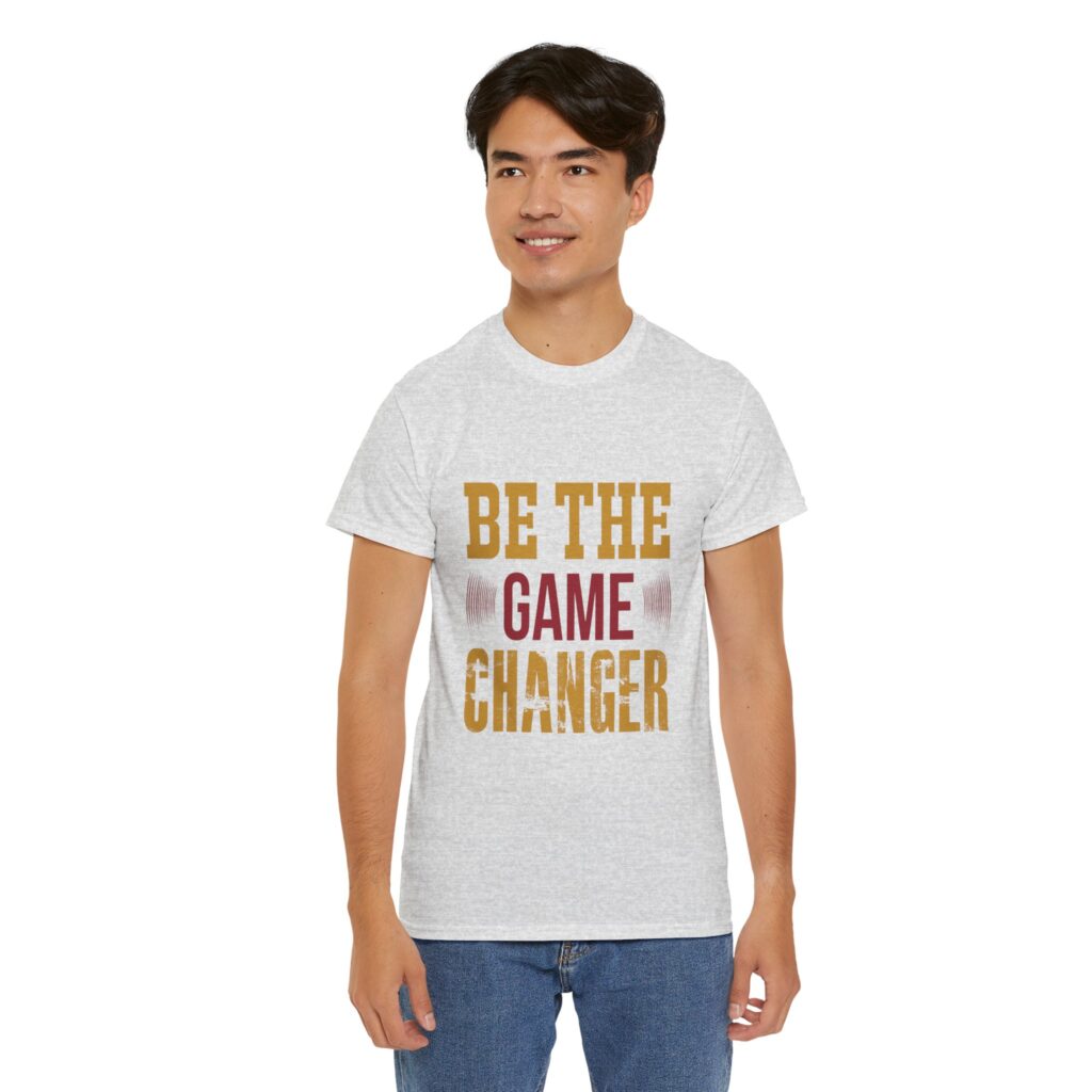 Ash unisex heavy cotton t-shirt with "Be The Game Changer" design shown on a man (front view)