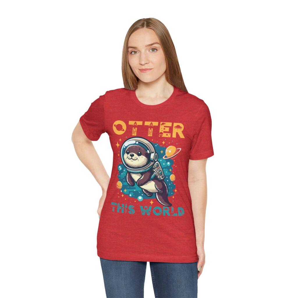 Woman wearing heather red unisex jersey short sleeve tee with Cute Otter design, front view
