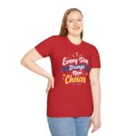 Red unisex softstyle t-shirt with 'Every Day Brings New Choices' design shown on a woman (front view)
