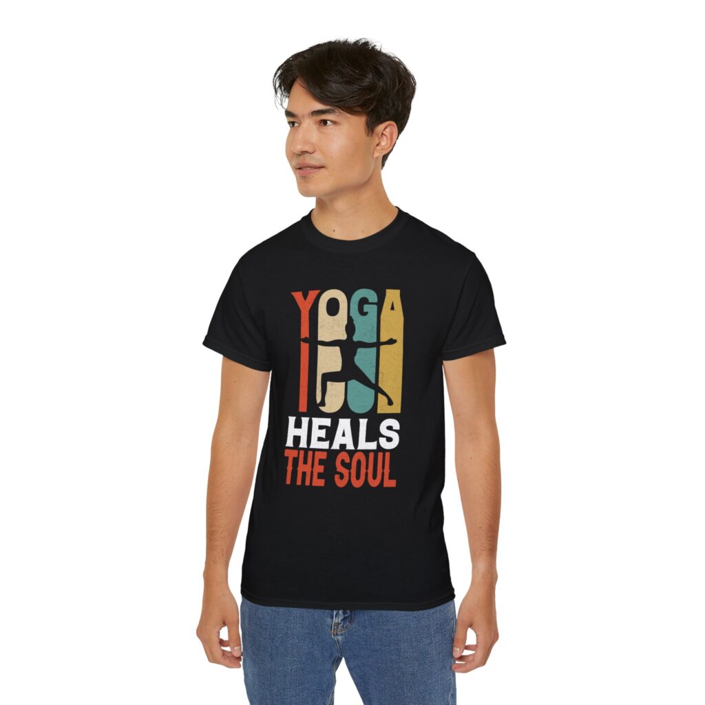 Man wearing black ultra cotton unisex tee with Yoga Heals the Soul design, front view