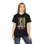 Woman wearing black ultra cotton unisex tee with Yoga Heals the Soul design, front view